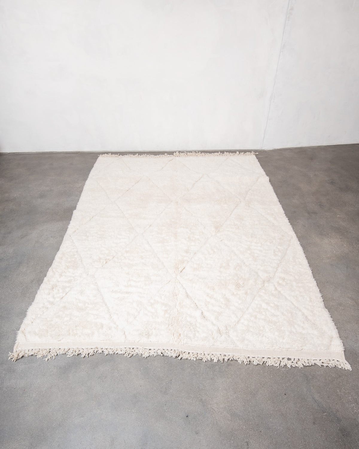 Modern, designer, handcrafted Berber rug from Morocco. Beniourain carpet with minimalist design, natural wool pile and a fluffy texture.